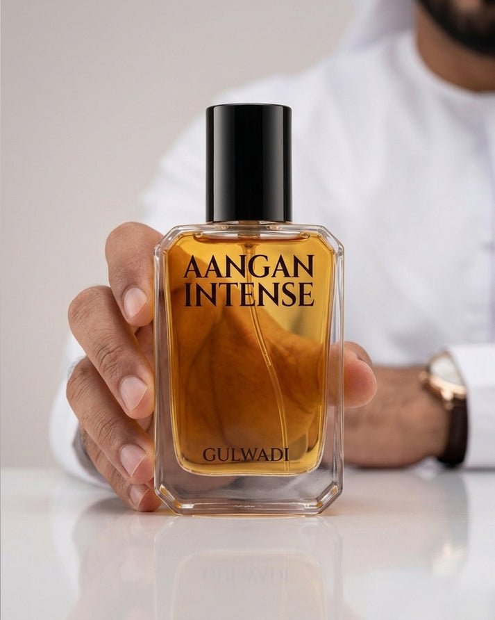 A bottle of Aangan Intense, a luxurious unisex oriental perfume with rich notes of oud and leather.