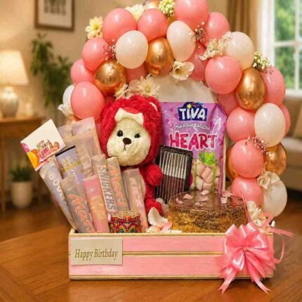 Birthday hamper delivery Lahore featuring chocolates, balloons, and a teddy bear.