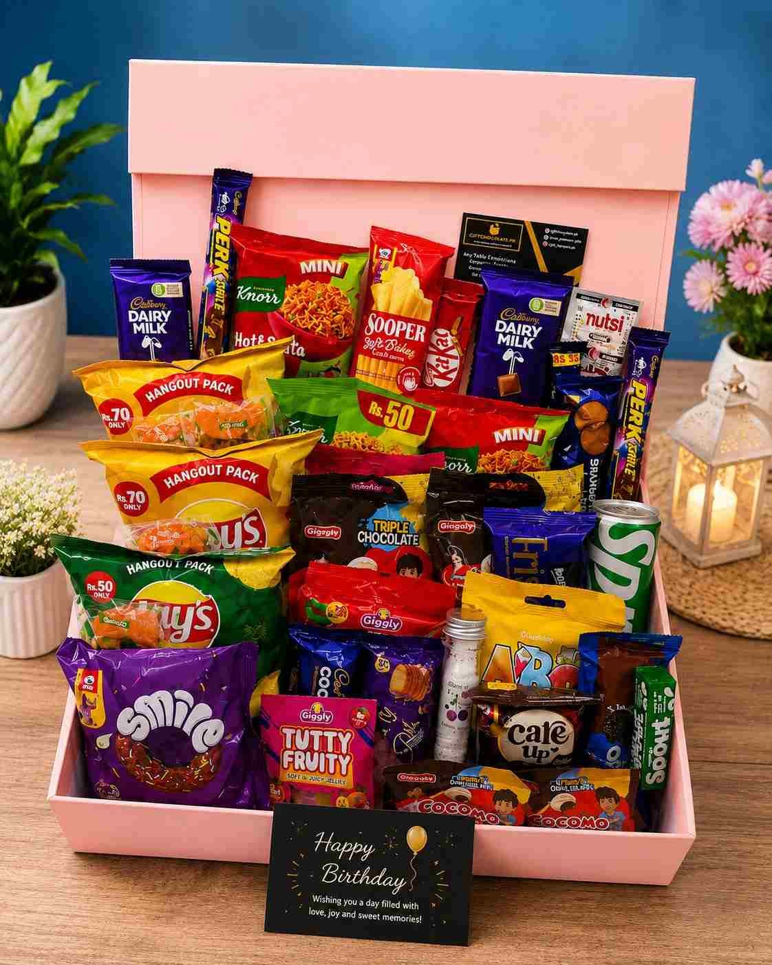 Birthday Gift Box Pakistan filled with chocolates, snacks, biscuits, noodles, and drinks.