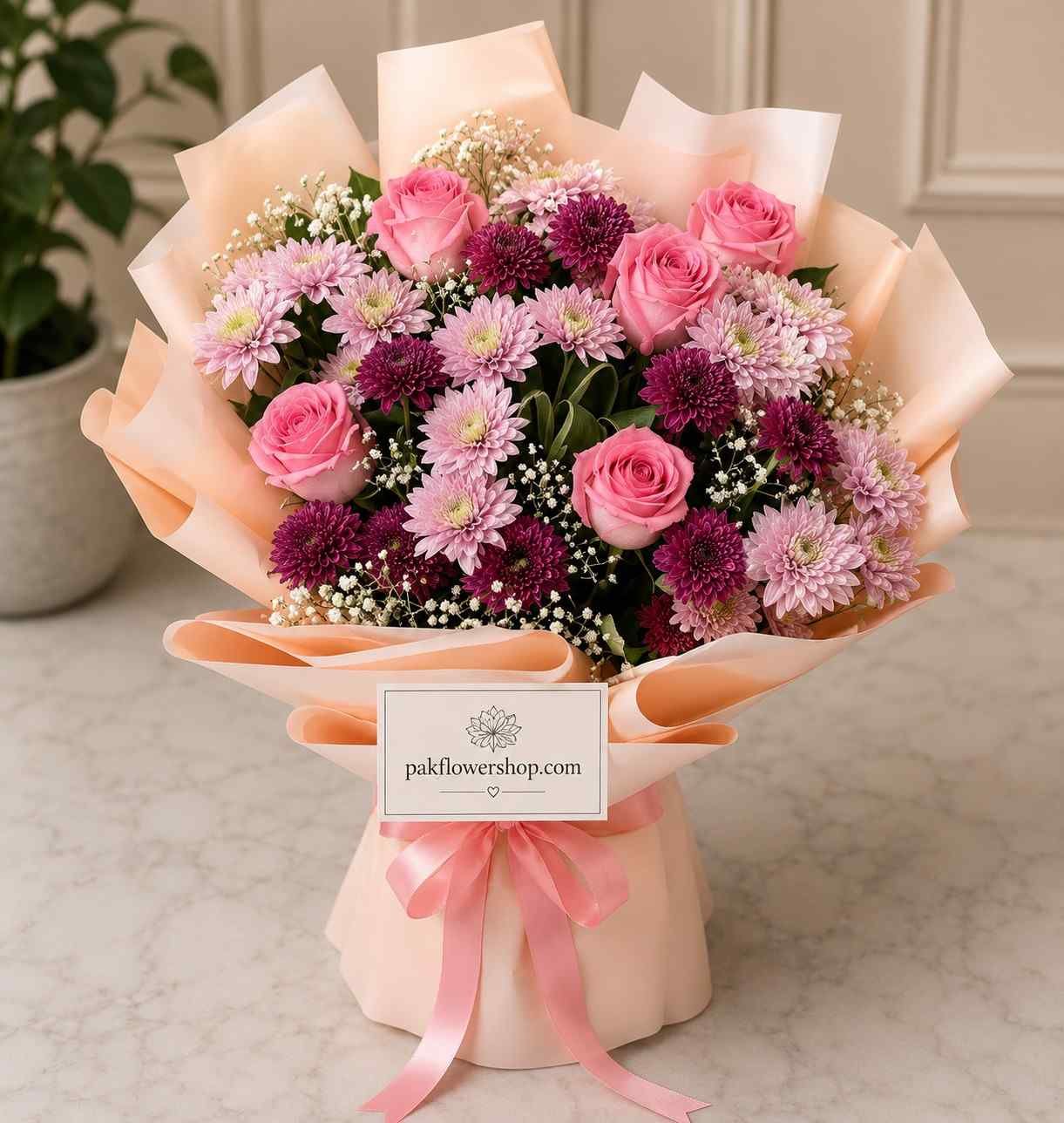 Fresh bouquet Lahore with pink roses and seasonal flowers.