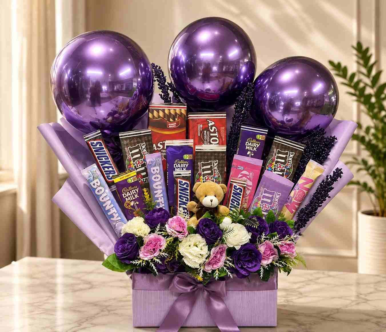 Chocolate gift bouquet Lahore with assorted chocolates, flowers, balloons, and teddy bear