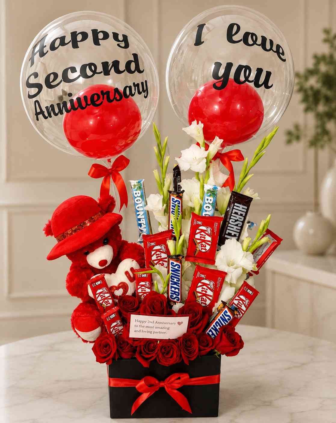 Anniversary Gift Box Pakistan with red roses chocolates teddy bear and balloons