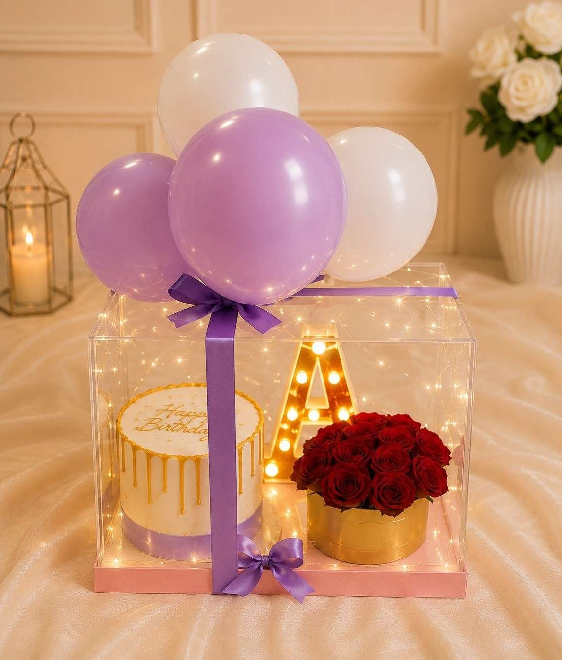 Transparent box with pastel balloons and red roses for the best gift delivery Lahore