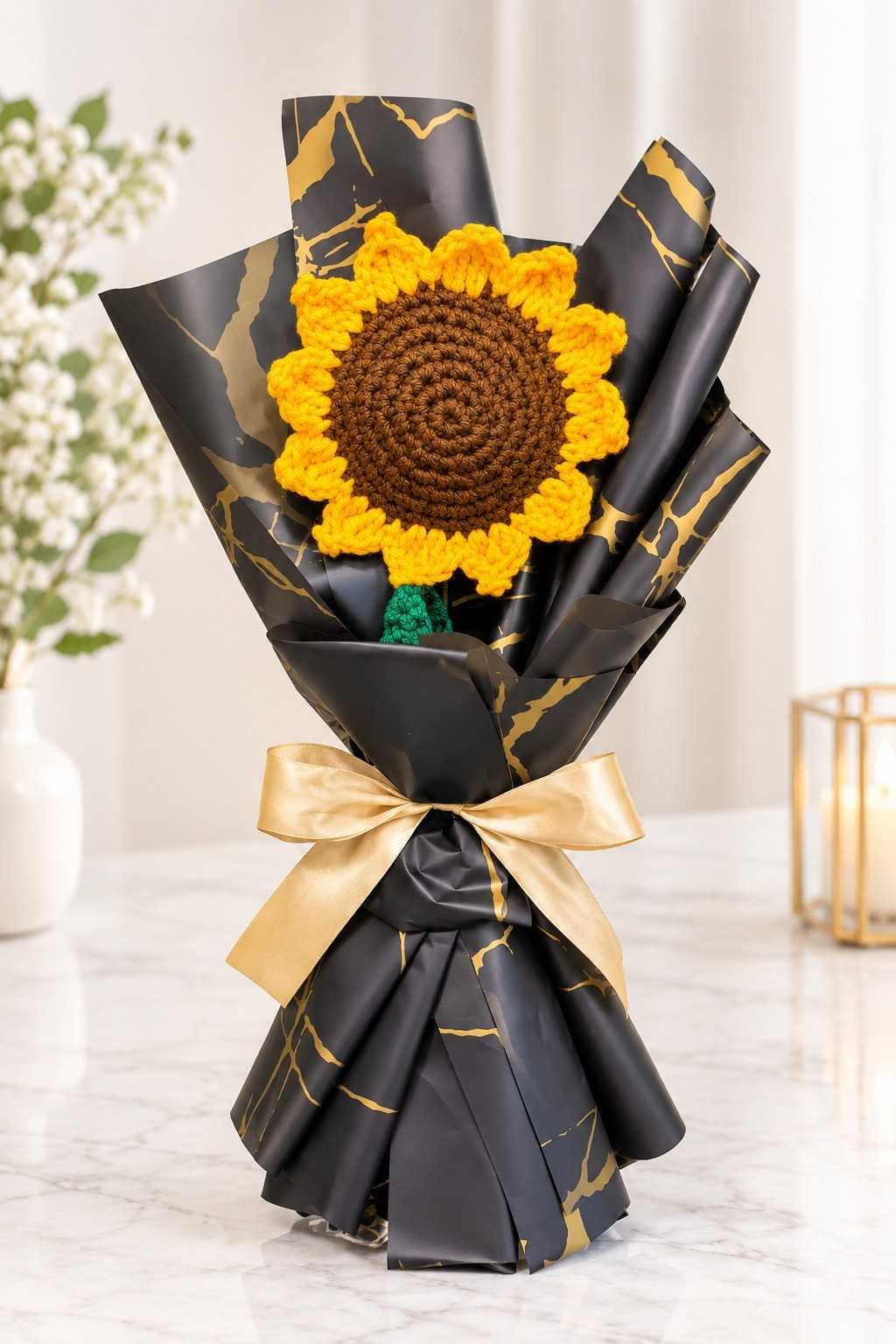 Crochet flower gift Lahore featuring handmade yellow sunflower and black gold wrapping