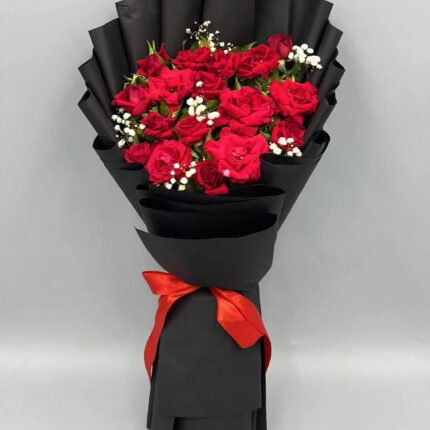 Bouquet of 12 local red roses with baby's breath in black wrapping with red ribbon