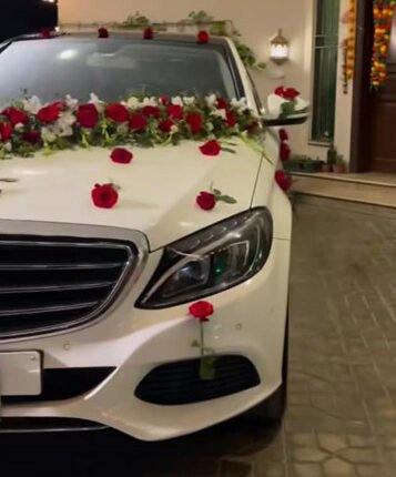 Vibrant red and white rose wedding car decoration price in Lahore