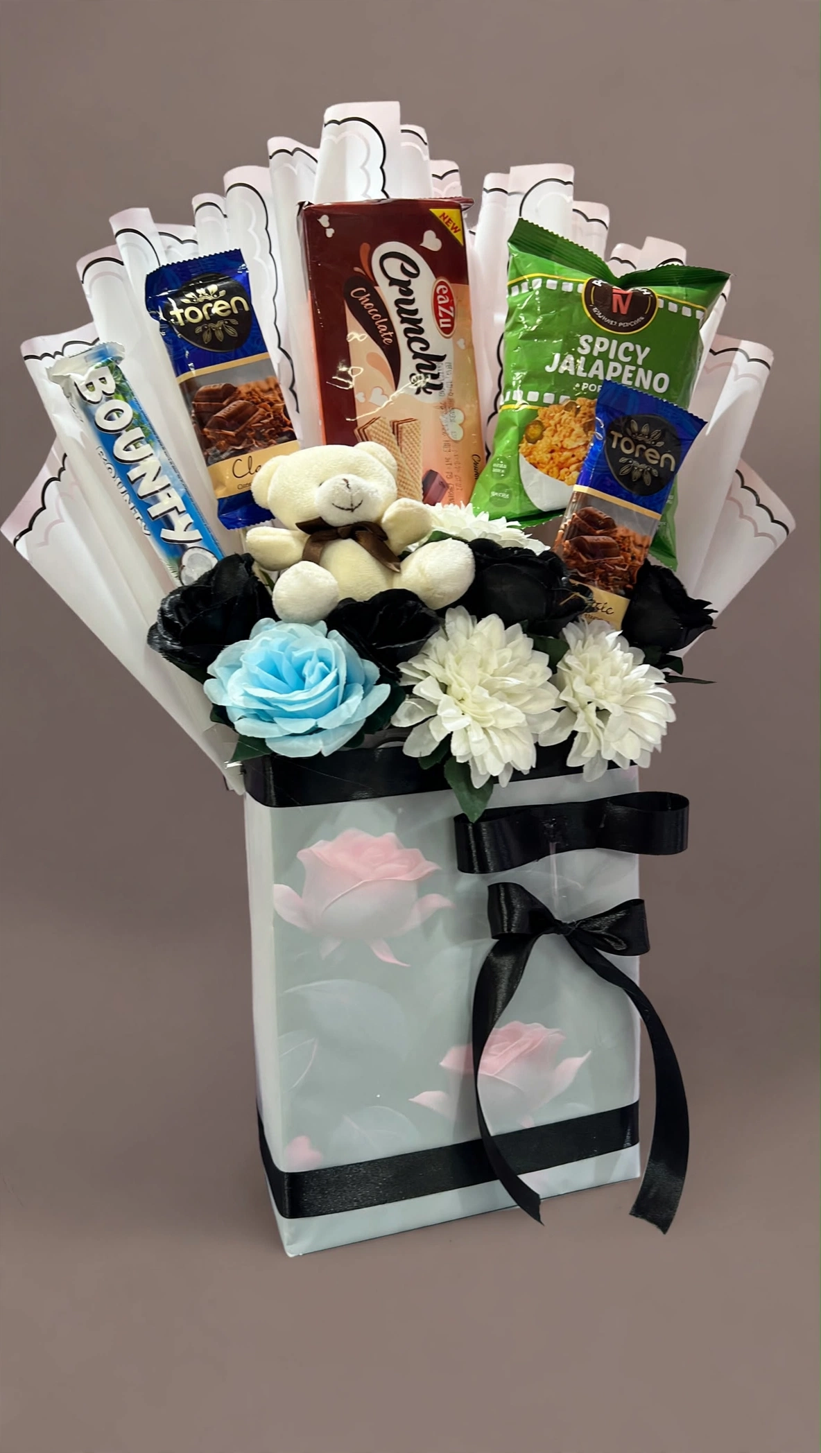 Chocolate snack gift bag with white teddy and blue rose