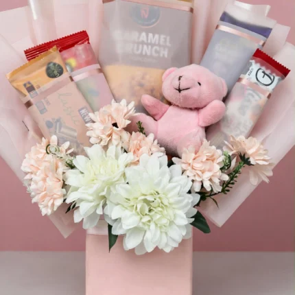 Blush snack gift bag with white chrysanthemums and pink teddy