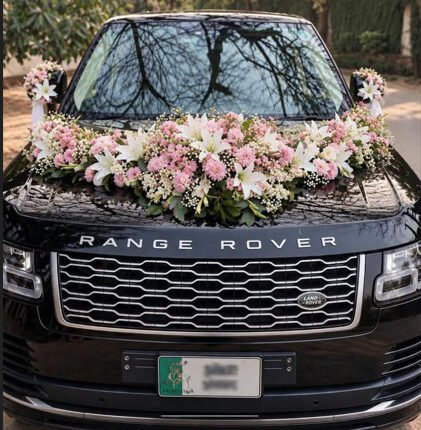 Elegant pink and white floral car decoration for wedding in Lahore