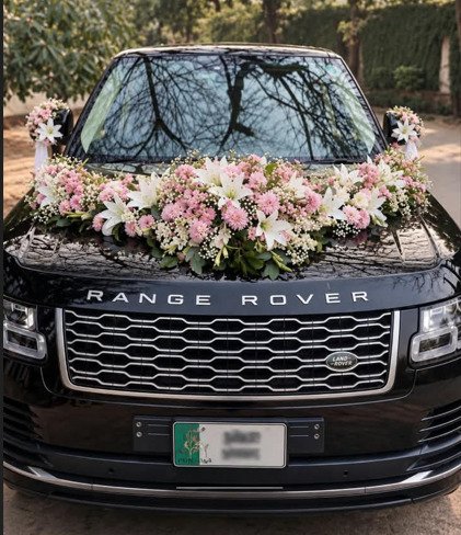 Elegant pink and white floral car decoration for wedding in Lahore