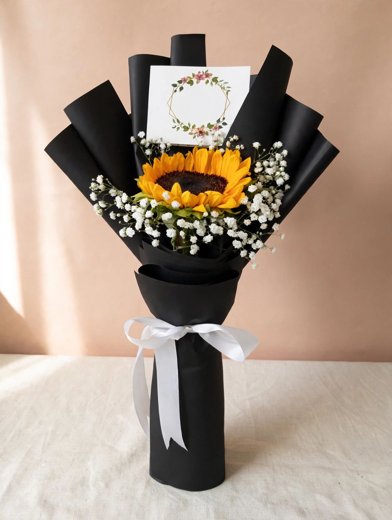 Single sunflower bouquet with black wrapping at a three-quarter angle