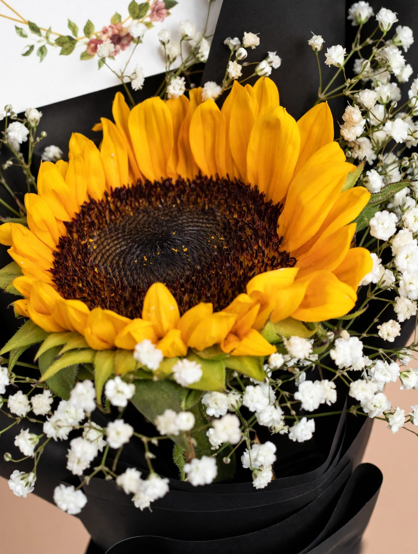 Close-up of a fresh sunflower with baby's breath